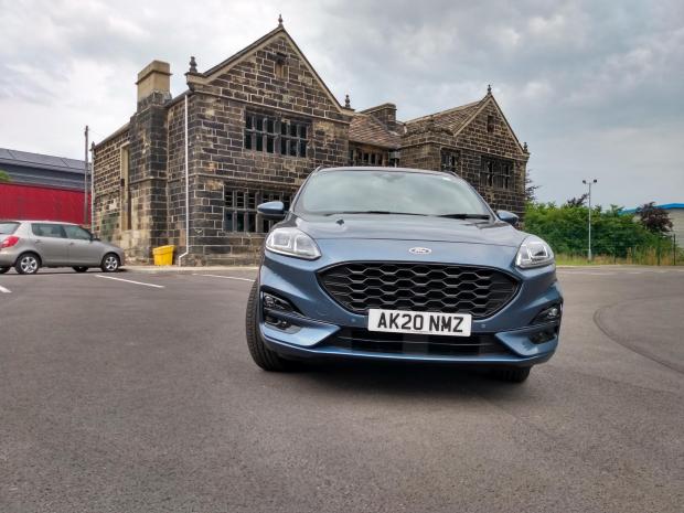 Clydebank Post: The Ford Kuga Phev next to the restored Grade II-listed New Hall, Rooley Lane, Bradford