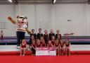 The Dynamite Gymnastics team with Courage the Cat from Clyde 1