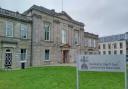 John Malcolm missed his court hearing at Dumbarton Sheriff Court