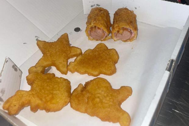 The chippy is serving mouthwatering battered pigs in blankets