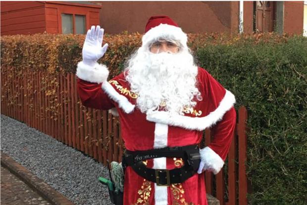 Clydebank window cleaner Jamie dresses as Santa for his festive rounds