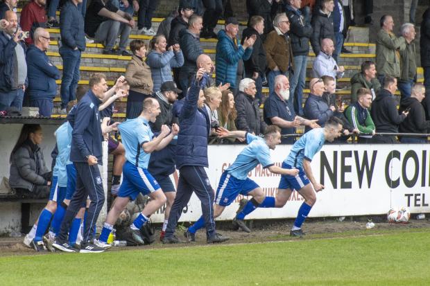 Yoker's substitutes and coaching staff burst on to the pitch at Newlandsfield on the final whistle in their semi-final win over Petershill (Photo - Stevie Doogan)