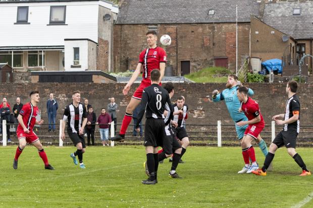 Matt Niven rises to meet a high ball as Clydebank booked their last eight place in the West of Scotland Cup with a 3-0 win at Kello Rovers on Saturday (Pic - Stevie Doogan)
