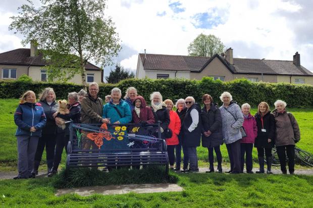 Knightswood Connects cut the ribbon on the bench located on the grass hill area of Pikeman Road.