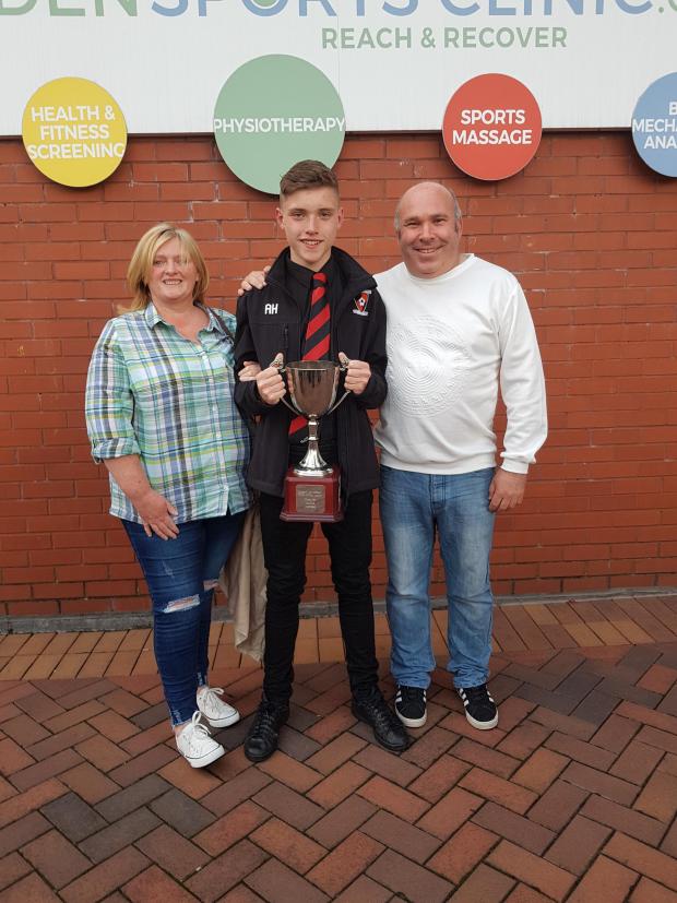 Clydebank Post: Aaron Hussey pictured with his parents Marie and Alan