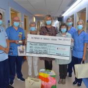 The staff met with the family to receive the cheque