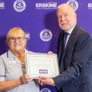 Caroline Gallagher being awarded the Erskine Long Service Award from Stuart Aitkenhead