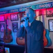 Craig Hevern performing in a bar in Tenerife