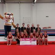 The Dynamite Gymnastics team with Courage the Cat from Clyde 1