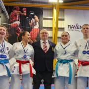 Coach Billy Haggarty celebrates with Louise Smith, Olivia Cuthbertson, Hannah Benson and Adam Jess after their success at the Scottish Karate Championships