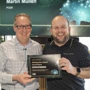 David Wallace, SLC Chief Customer Officer presenting the shining star award to Martin Mullen