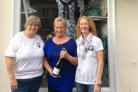 Trustees Donna Hingley and Kathy Forrest (left and right) with first customer Mrs Marlene Roy