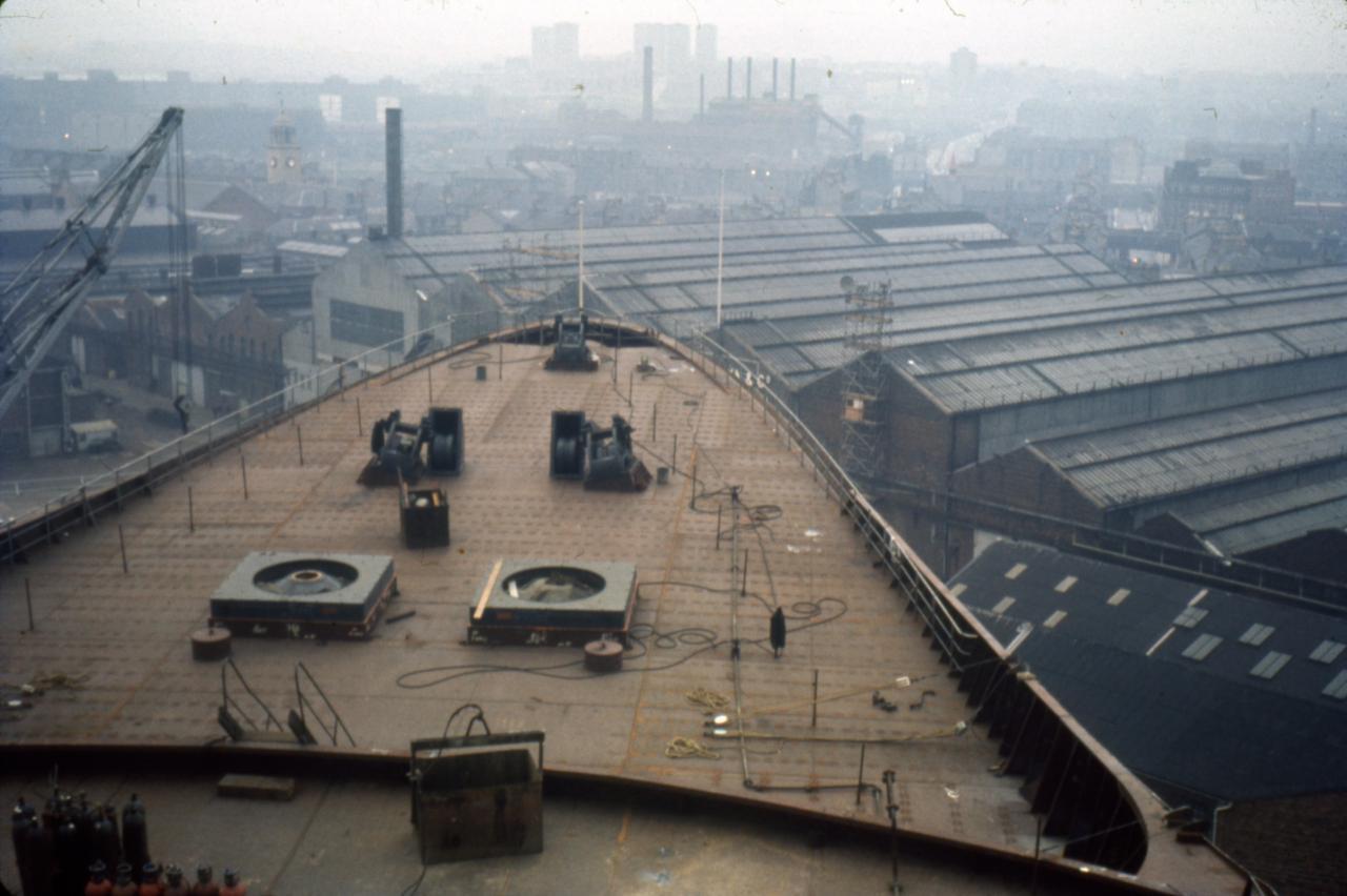 Looking out from the bow of the QE2 over Clydebank, with the town hall tower to the left and Co-op building to the right